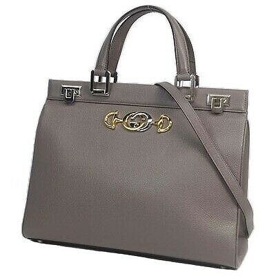 ladies zumi grainy leather medium top handle bag in black